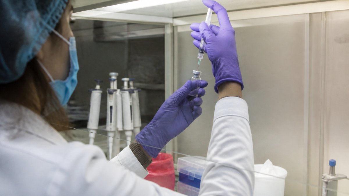 Researcher following sterile safety protocols while preparing an injection of untested research peptides